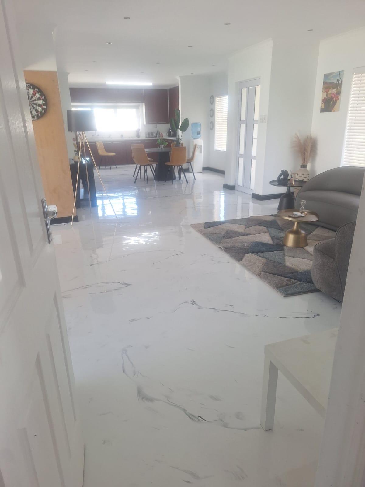 Marble-look epoxy floor with flowing light and dark patterning